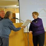 Trese Graddon, right, presents Wanda Manseau, with an award for her service to the Federal Way Day Center. Heidi Sanders, the Mirror