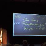 During his State of the City address on Monday, Mayor Jim Ferrell shows a picture of what he wrote on a beam placed in the Federal Way Performing Arts and Event Center during construction. Below his name, Ferrell wrote, Together we build, which was also the theme of the speech he gave in the PAEC. HEIDI SANDERS, the Mirror