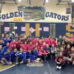 Female wrestlers from Federal Way, Decatur, Todd Beamer and Thomas Jefferson pose for a group photo following the second annual all-city girls wrestling meet. District coaches agree the quality of wrestling has gone up in recent years, as has the interest in the sport as more girls are realizing it is not just for boys. Contributed photo
