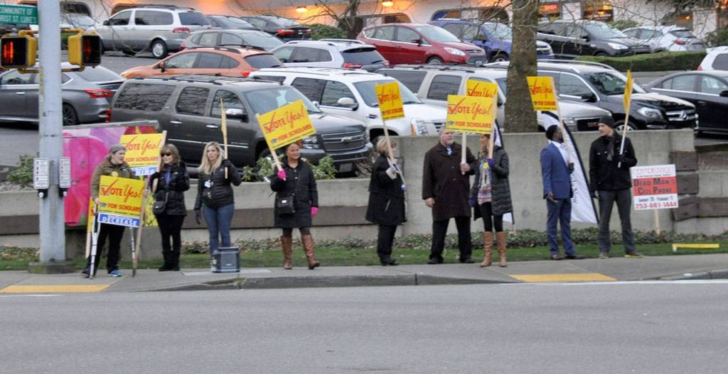 Sign wavers at the corner of South 320th Street and First Avenue South urge last-minute voters to cast a ballot for the Federal Way Public Schools levy. Heidi Sanders, the Mirror
