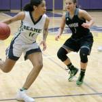 Todd Beamer High School senior guard Chasity Spady looks for an opening in the Titans 4A regional girls basketball state playin game Feb. 23. Union defeated the Titans 48-37, ending Todd Beamers postseason. JESSICA KELLER, the Mirror