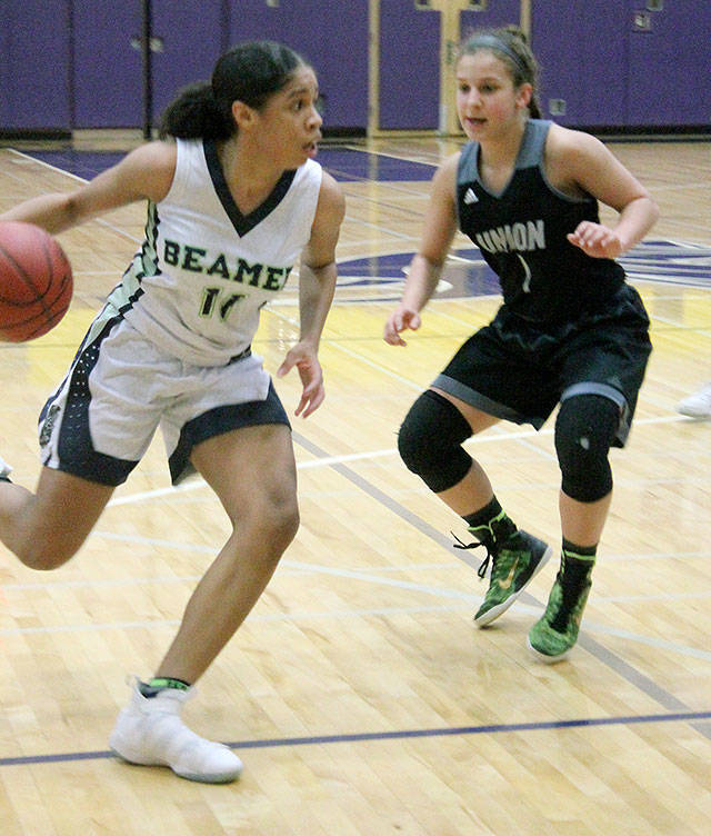 Todd Beamer High School senior guard Chasity Spady looks for an opening in the Titans 4A regional girls basketball state playin game Feb. 23. Union defeated the Titans 48-37, ending Todd Beamers postseason. JESSICA KELLER, the Mirror