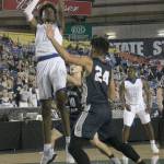 Federal Ways Jaden McDaniels shoots a field goal in Saturdays WIAA 4A boys state championship game against Gonzaga Prep at the Tacoma Dome. McDaniels scored 14 points and grabbed six defensive rebounds in the Eagles 54-52 loss to the undefeated Bullpups. JESSICA KELLER, the Mirror