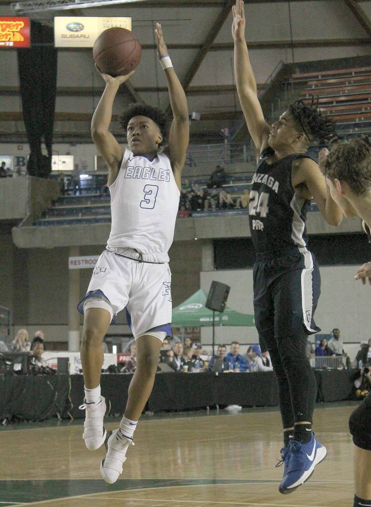 Federal Ways Jalen Womack tries for a field goal in the WIAA 4A state boys basketball championship game against Gonzaga Prep Saturday at the Tacoma Dome. The Eagles lost 54-52. JESSICA KELLER, the Mirror