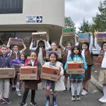 Girl Scout troop donates cookies to Federal Way Day Center