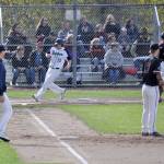 Todd Beamers Tate Wallat crosses home plate on a RBI from Colin Floyd during the Titans 2-1 victory over Enumclaw Monday. Floyd hit in both runs. HEIDI SANDERS, the Mirror