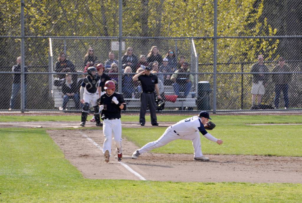 Todd Beamers Jared Thompson makes a play to get Enumclaws Cameron Jarvis out at first. HEIDI SANDERS, the Mirror