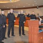 Federal Way Mayor Jim Ferrell, right, swears in new hires for the citys police department during Tuesday nights council meeting. The new officers are, from left, Ricardo Cuellar, Eric Reyna, Bryan Mullet, Cody Robertson and Richard Graham. HEIDI JACOBS, the Mirror