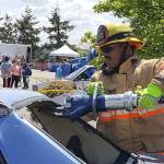 A firefighter demonstrates the Jaws of Life during a Touch a Truck event. Courtesy city of Federal Way