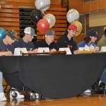 Todd Beamer High School baseball players sign to play at the college level during a ceremony on May 4. From left are Tommy Davis, Colin Floyd, Tate Wallat, Ayden Adams and Jordan Taylor. HEIDI JACOBS, the Mirror