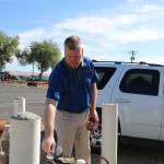 Roza Irrigation District manager Scott Revell inspects a water gauge in the lower Yakima Valley. If a drought pump is installed in Kachess Lake it would mean a more reliable source of water for crops in the valley. Aaron Kunkler/Staff photo