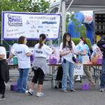 Doug Baxter, right, raffles off baskets during the Federal Way Coalition Against Traffickings annual Break the Chains 5K last Saturday. Baxter has served as emcee for the event for the past three years. Courtesy Shelley Pauls