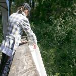 A sixth-grade student at Woodmont K-8 releases a salmon during Storming the Sound with Salmon on Wednesday. HALEY DONWERTH, the Mirror