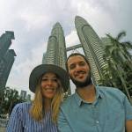 Madison and Jake Leland smile in front of the Petronas Towers in Kuala Lumpur, Malaysia, in May, one of the many countries they have explored in their extensive travels. COURTESY PHOTO