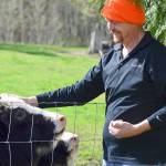 Farmer Steven Young offers alfalfa cookies to his charges at Yaks in the Cradle in Quilcene. (Diane Urbani de la Paz/for Peninsula Daily News)
