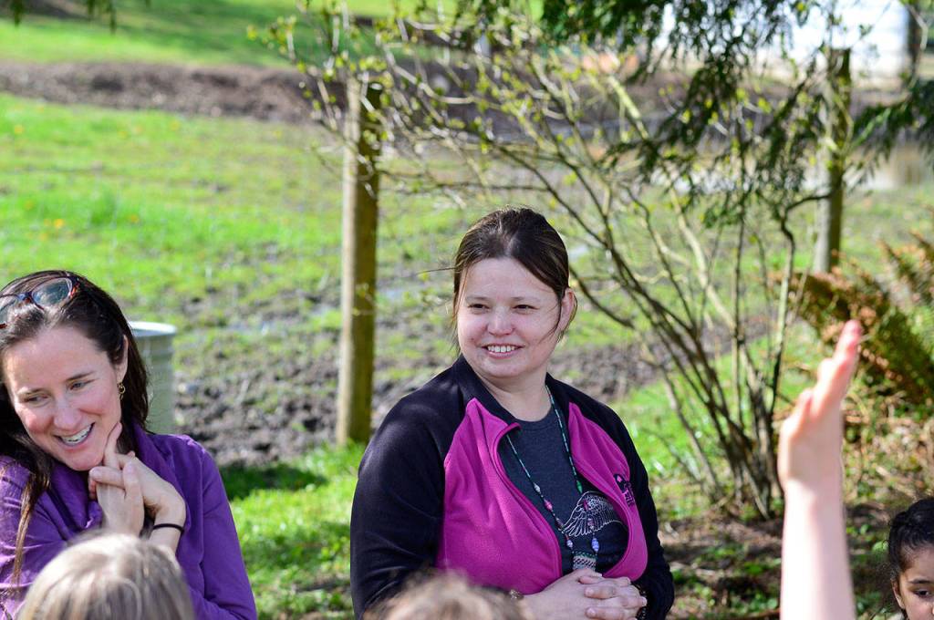Jefferson County 4-H coordinator Tanya Barnett, left, and Yaks in the Cradle farmer Patricia Young take questions from a flock of visiting children. (Diane Urbani de la Paz/for Peninsula Daily News)