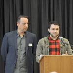 David Brambila, right, speaks about the of impact his mentor, Brett Hulse, right. The duo, who were paired through Communities in Schools mentoring program when Brambila was in fifth grade, shared their story at the Communities in Schools annual fundraising breakfast in April. HEIDI JACOBS, the Mirror
