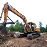 Pillons own excavator sits atop the hill overlooking his junkyard. It is one of the few functional vehicles on the property. Photo by Caean Couto