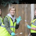 Volunteers Paint the Fence to help beautify the city