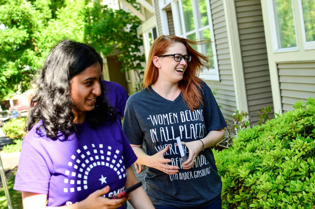 Sarah Smith (right) door-knocking in Seattles New Holly neighborhood in Southeast Seattle on July 7. Photo by Josh Kelety