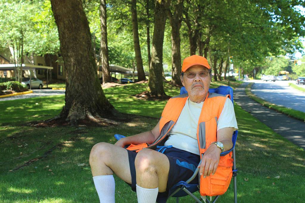 From April to August, Yee sits near a duck crossing sign next to the apartments to make sure the baby geese and ducklings can cross safely. HALEY DONWERTH, the Mirror