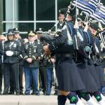 Bagpipers march in front of the accesso ShoWare Center on Tuesday prior to the memorial service for Kent Police Officer Diego Moreno. STEVE HUNTER, Kent Reporter