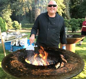 John Hatcher with Cafe Pacific Catering fires up tasty kebabs at FUSIONs 25th annual summer arts gala held Wednesday at Dumas Bay Centre. Photo by Andy Hobbs, the Mirror
