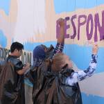 5th graders at Rainier View Elementary School paint a mural representing the schools core values and mission. Photo by Olivia Sullivan, the Mirror