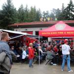 Construction workers completing the renovation of Fire Station 64 watched the ceremony from the rooftop. Olivia Sullivan/staff photo