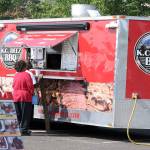 Patrons order some slow-cooked barbecue at the K.C. Deez BBQ trailer, which is one of the nine featured restaurants at the Taste of Federal Way on Sept. 22. Photo courtesy of Rose Ehl/Federal Way Farmers Market
