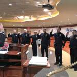 Mayor Jim Ferrell gives the oath of office to six new members of the Federal Way Police Department at the Sept. 18 council meeting. Photo courtesy of Kurt Schwan/Federal Way Police Department