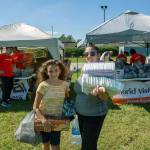 Sarah Guzman, 34, and her daughter, Vaida, 9, receive supplies from World Visions relief efforts in North Carolina after Hurricane Florence. Courtesy photo