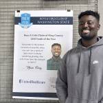 Khairi Perry stands in front of a poster at the Federal Way Boys and Girls Club in Federal Way recognizing him for winning the King County Youth of the Year honor earlier this year. File photo