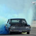 Ron Buckholz used specialized blue and green dye tires from Australia to show some Seahawks pride during his world record-setting burnout. Olivia Sullivan/staff photo