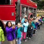 Students from Lake Grove Elementary School show off their firefighter badge stickers. Photo courtesy of Patty Samora                                Students from Lake Grove Elementary School show off their firefighter badge stickers. Photo courtesy of Patty Samora