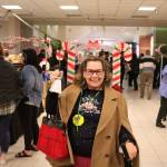 Susan Honda rallies the market goers for the performances at Candy Cane Lane. Olivia Sullivan/staff photo