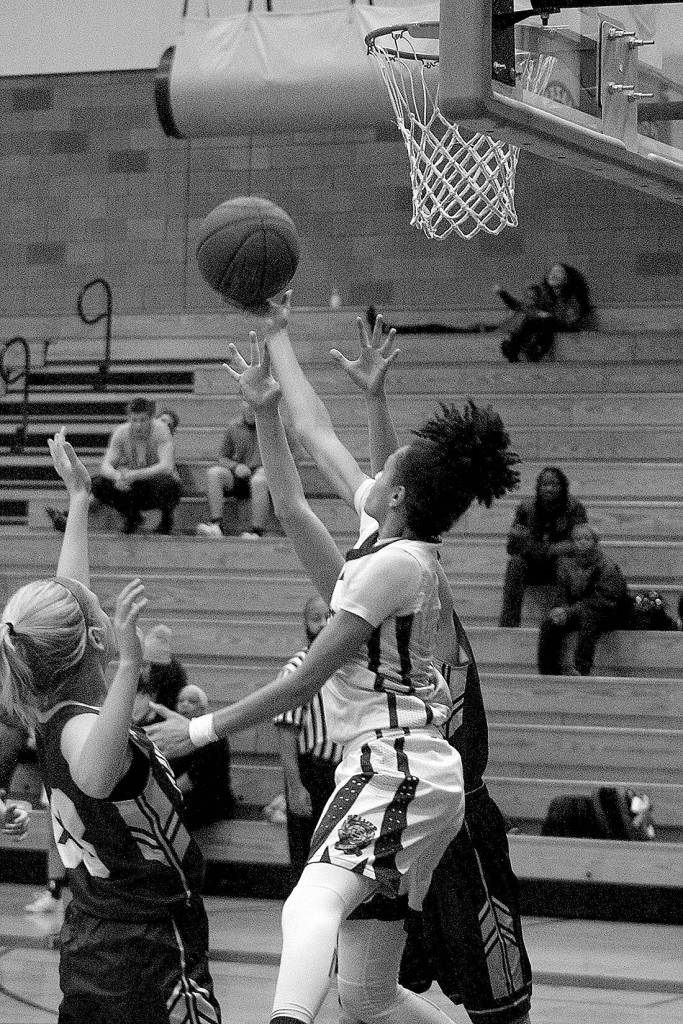 Junior Sharay Trotter, in the white jersey, goes for a layup. The Todd Beamer Titans won 47-30.