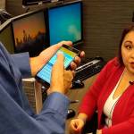 Jim House and Michelle Torresdiaz demonstrate King Countys new Text to 911 service on Dec. 20. Aaron Kunkler/staff photo