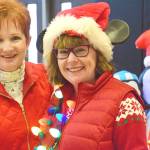 Janice Siebenaler, left, volunteers with Federal Way Deputy Mayor Susan Honda during the recent Federal Way Cares for Kids event at Lakota Middle School. Even though Siebenaler is no longer active on the organizations board, she still helps the nonprofit with their annual event that provides Christmas presents to 200 local families in need. Photo courtesy of Bruce Honda