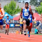 Federal Way High School junior Marcus Eubanks sprints toward the finish line as anchor of the FWHS boys 4x1 relay at the WIAA 4A State track and field championships in May 2018. Mirror file photo