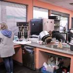 People experiencing homelessness use the kitchen facilities at the Federal Way Day Center on Wednesday afternoon. The day center offers showers, laundry, space for meal preparation, and other services for those in need. Olivia Sullivan/staff photo