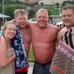 Annika Hansen, left, Matt Hansen, Mark Hansen and Matt Stauffer dry off and warm up after their New Years Day jump. Olivia Sullivan/staff photo