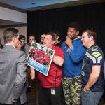 Federal Way Thunder shows off their gift to Dion Jordan to news reporters at Jordans Christmas party held for Special Olympics athletes. Courtesy photo