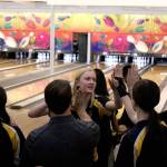 Decaturs Natalie Hansen, center, high-fives teammates and head coach Mike David, second from left, at the NPSL tournament on Jan. 16. Olivia Sullivan/staff photo