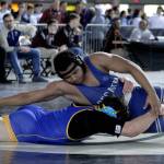 Decatur junior Sampson Mitchell traps his opponent at the Mat Classic XXXI state finals on Saturday, Feb. 16. Olivia Sullivan/staff photo