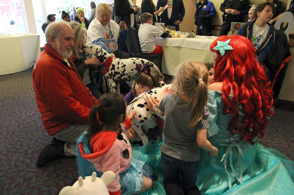 Therapy dogs roamed the event with their owners, welcoming many hugs, pets and kisses from all ages. Olivia Sullivan/staff photo
