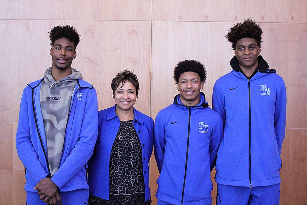 FWPS Superintendent Dr. Tammy Campbell poses with a few members of the Federal Way Eagles basketball team. Olivia Sullivan/staff photo
