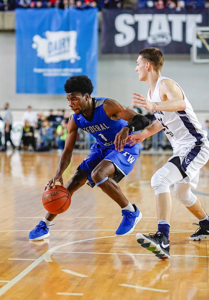 Federal Way senior Jishai Miller, No. 1, fends off a Gonzaga Prep player. Photo courtesy of Senad Tiric