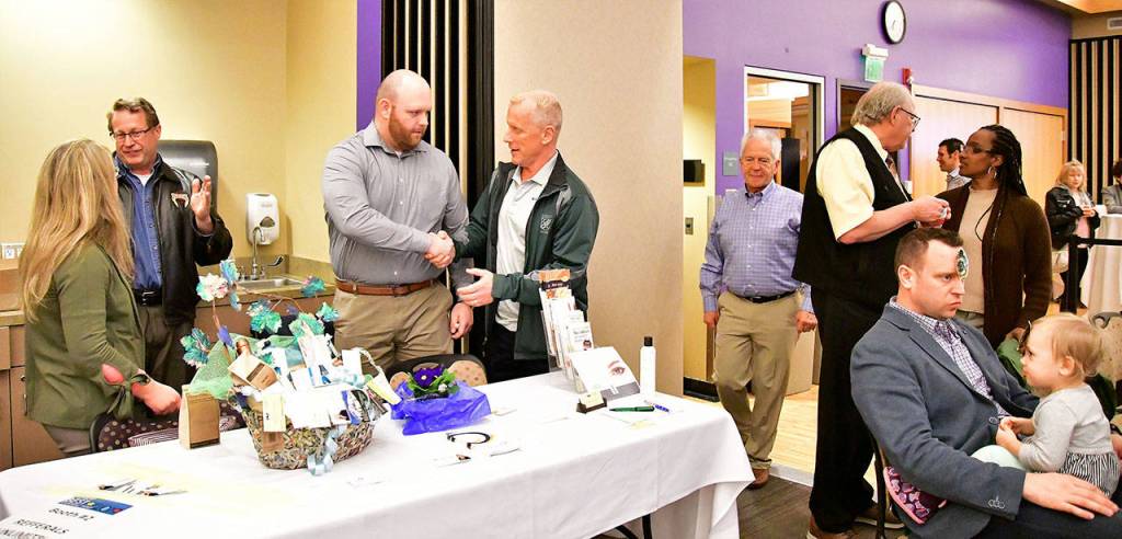 Attendees mingle and check out more than 20 vendors during the event. Photo courtesy of Bruce Honda