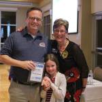 A Five Star Painting representative receives the first-place award for best residential painter. Olivia Sullivan/staff photo